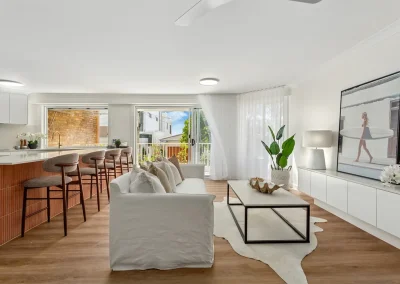 Renovated apartment living space with new flooring at Gold Coast Highway Palm Beach