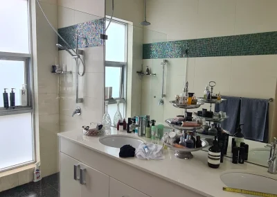 Original bathroom layout with worn fixtures before renovation in Currumbin