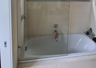 Outdated bathroom vanity and shower before renovation in Currumbin