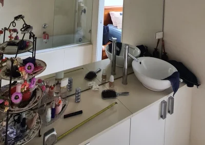 Old bathroom with dated tiles and fittings before renovation in Currumbin