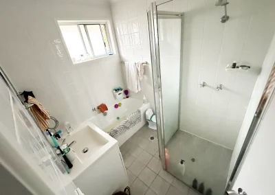 Original bathroom with dated finishes before renovation in Bilinga Gold Coast