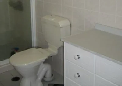 Worn living areas before full renovation at Koomooloo Court Mermaid Waters