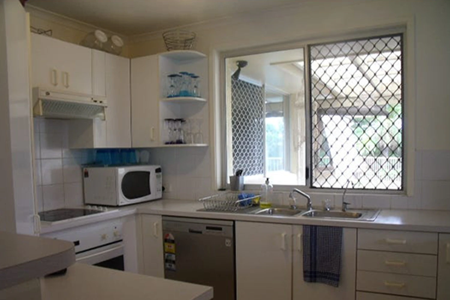 Old interior with tired finishes before home renovation at Koomooloo Court Mermaid Waters