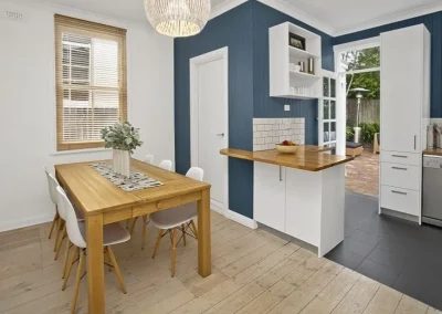 Old kitchen with dated cabinetry before renovation in Burleigh Heads