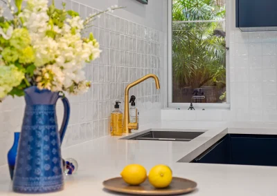 Modern kitchen renovation with updated benchtops and storage in Currumbin