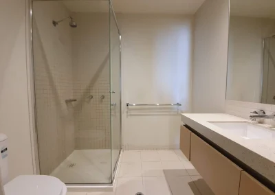 Original bathroom with dated fixtures before renovation at Fifth Avenue Palm Beach