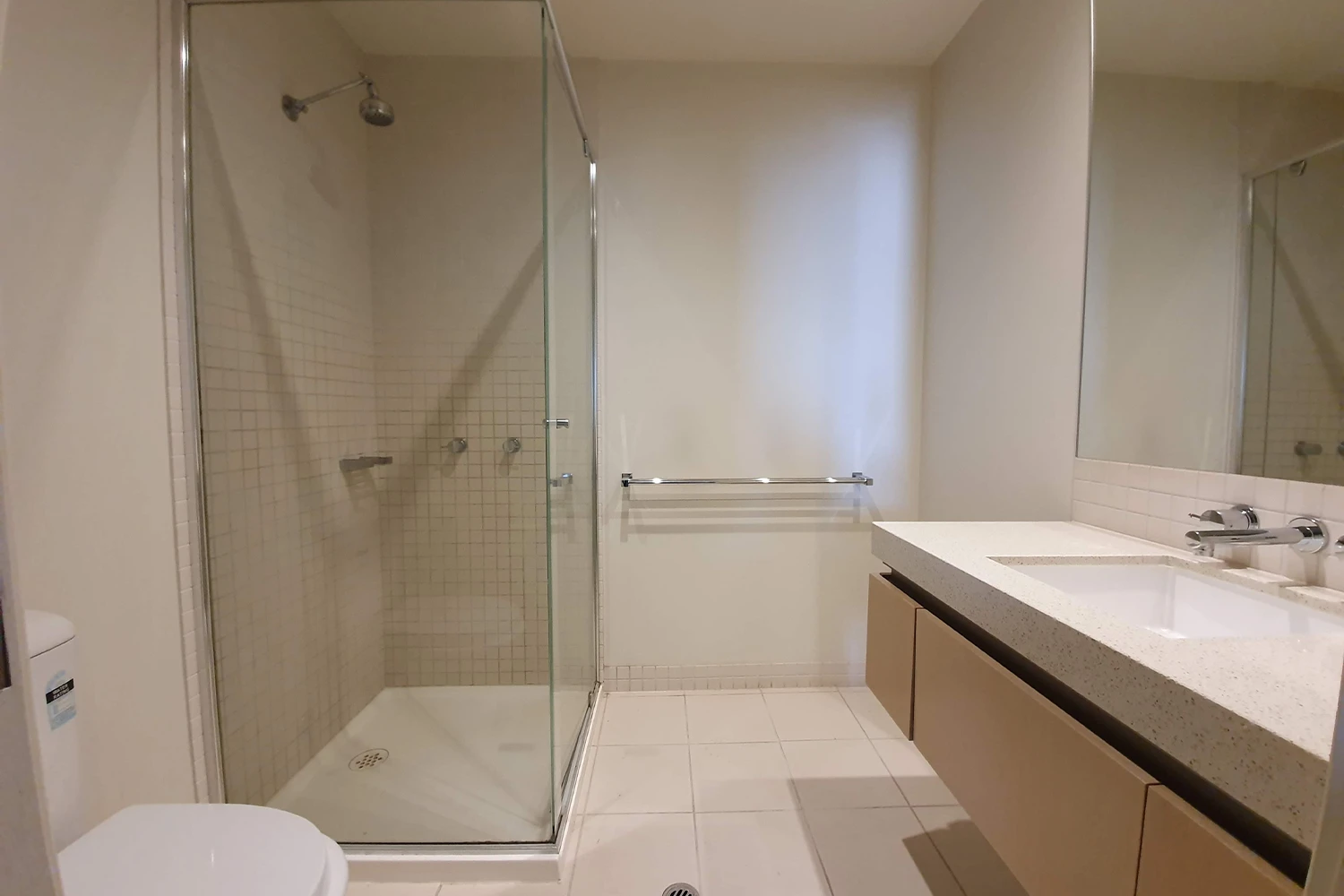 Original bathroom with dated fixtures before renovation at Fifth Avenue Palm Beach