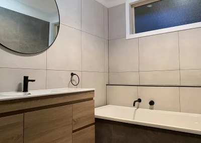 Modern bathroom renovation with quality tapware at Fifth Avenue Palm Beach