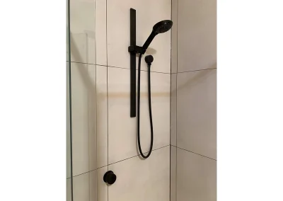 Completed bathroom renovation with fresh styling at Fifth Avenue Palm Beach