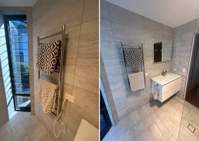 Finished bathroom with built-in bath, heated towel rail and wall-mounted vanity in Currumbin